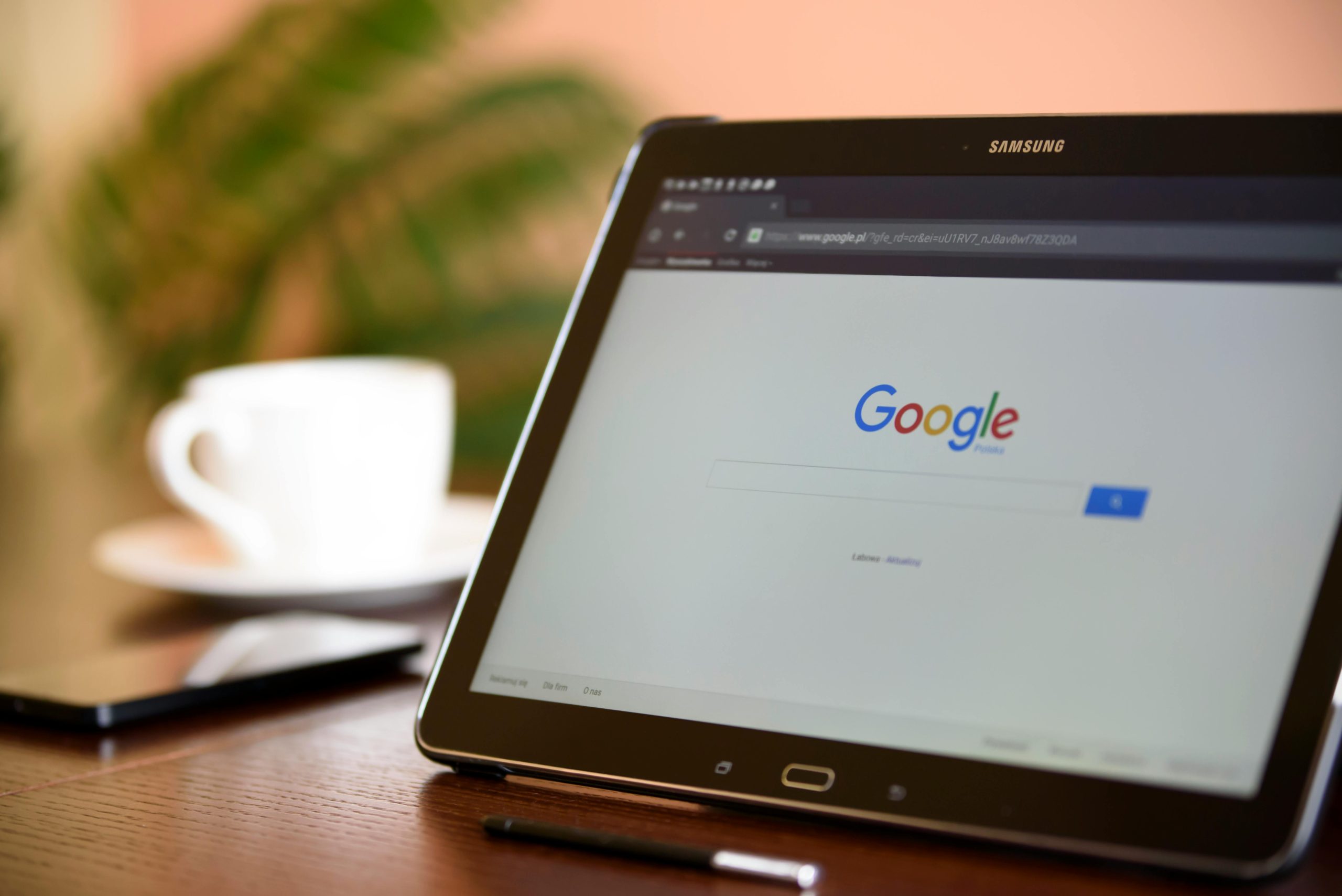 Laptop sitting on table with Google search on screen.